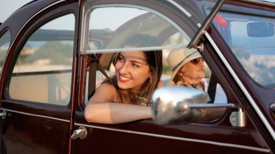 grandmother on a road trip with granddaughter