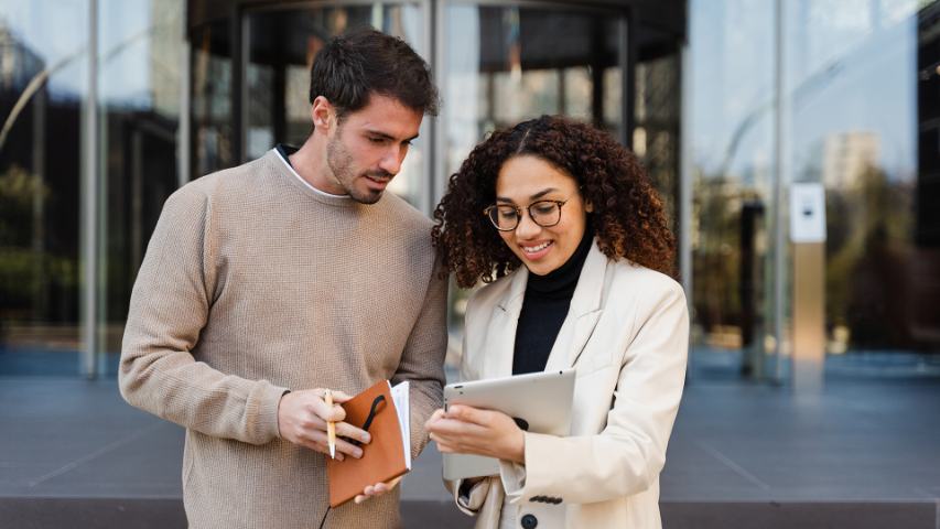 colleagues looking at tablet